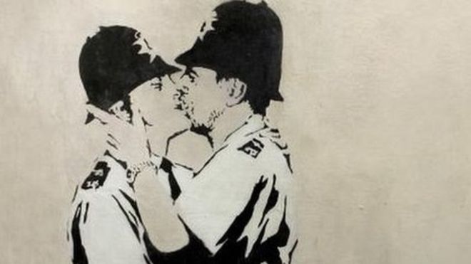 Banksy's Kissing Coppers Image via BBC