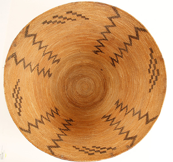 Large, circa 1900-1910 Mono basket, 19 ½ inches tall, intended for utility or cooking but never used and probably made for sale to the Anglo market, displaying zig-zag patterns ($2,625).