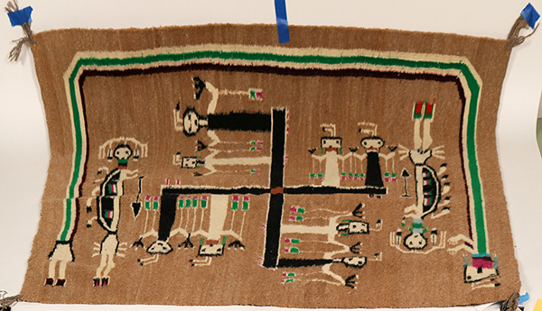 Hand-woven Navajo rug with a tribal design, 39 ½ inches by 44 inches, made by America’s Natives from the Russell Foutz Indian Room in Farmington, New Mexico ($2,875).