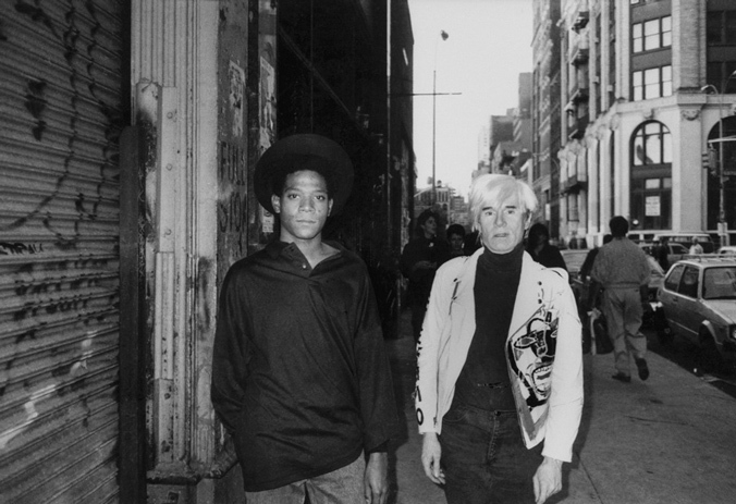 Basquiat with Andy Warhol in New York, 1985. Photo via Sleek Magazine.