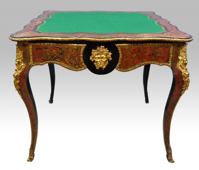 A 19th century French Boulle folding card table had a final price of £1,905. It had a serpentine front with gilt metal mounts on cabriole legs