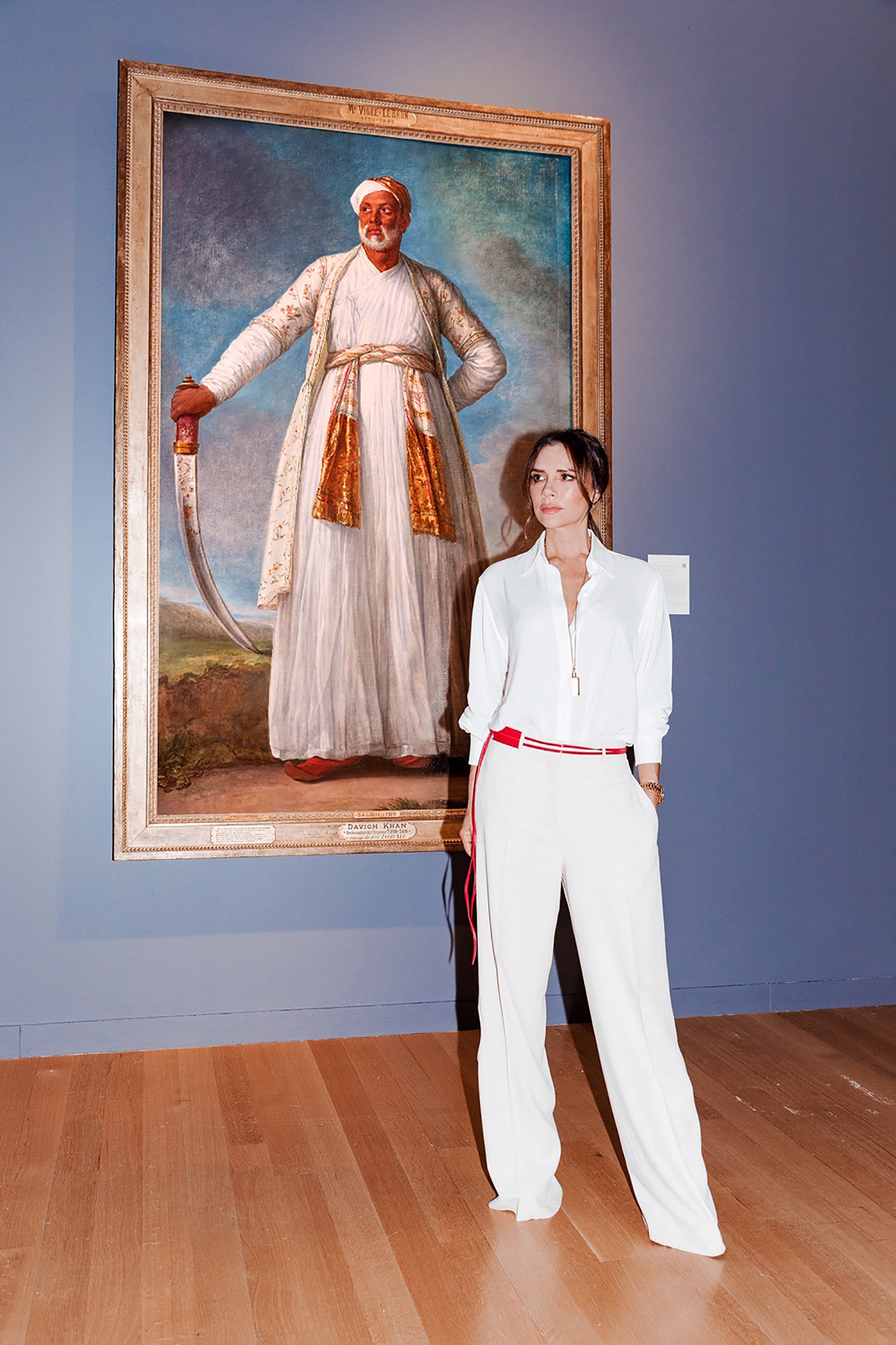 Victoria Beckham stands next to Vigée Le Brun's portrait of the Indian ambassador to celebrate the ‘Female Triumphant’, 21 works of female Old Masters exhibited at Sotheby's in January. Photo: Tom Newton, Vogue