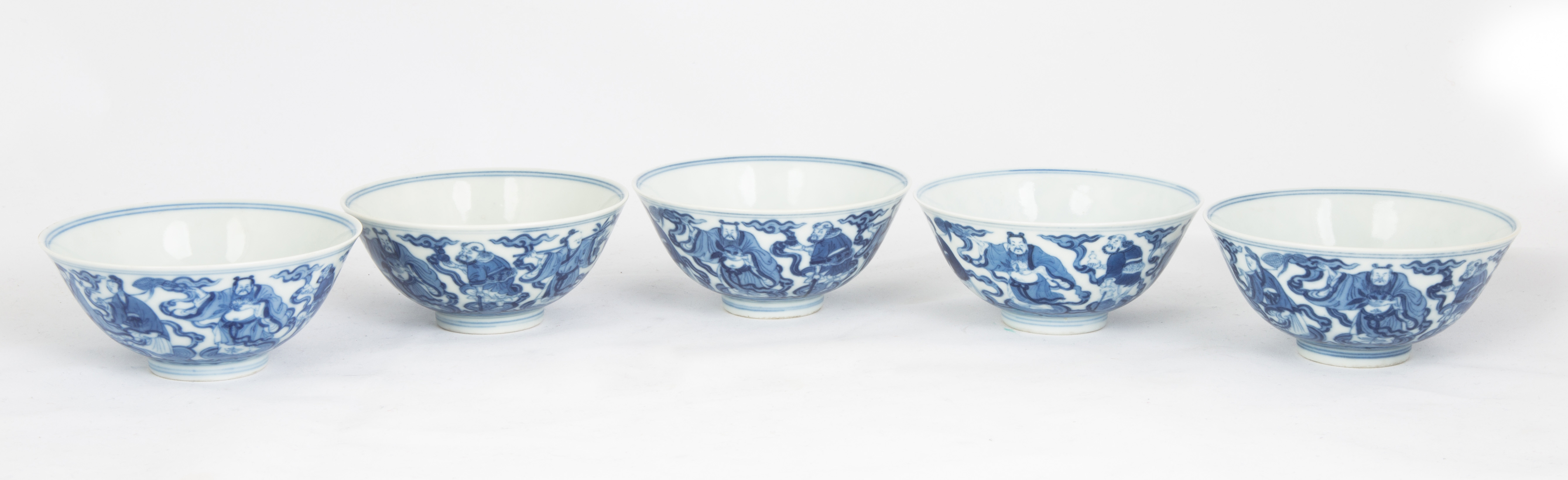 Rare set of nine Chinese blue and white Eight Immortals bowls, each one 2 inches tall and 4 ¼ inches in diameter and carrying the 6-character Daoguang character reign mark ($118,000).