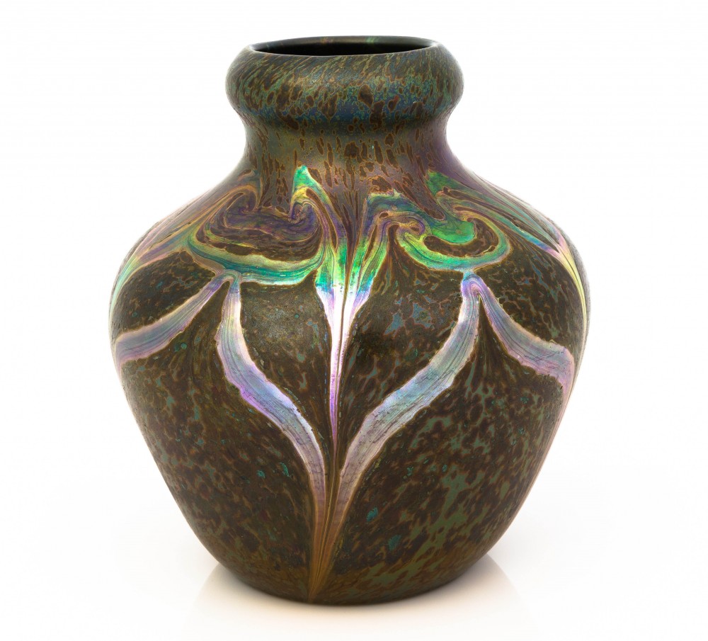 Tiffany Studios (N.Y.) decorated Cypriote vase, circa 1899, 9 inches tall, with the rough surface textures resembling the decomposed surfaces of Roman glass buried for centuries ($36,600).