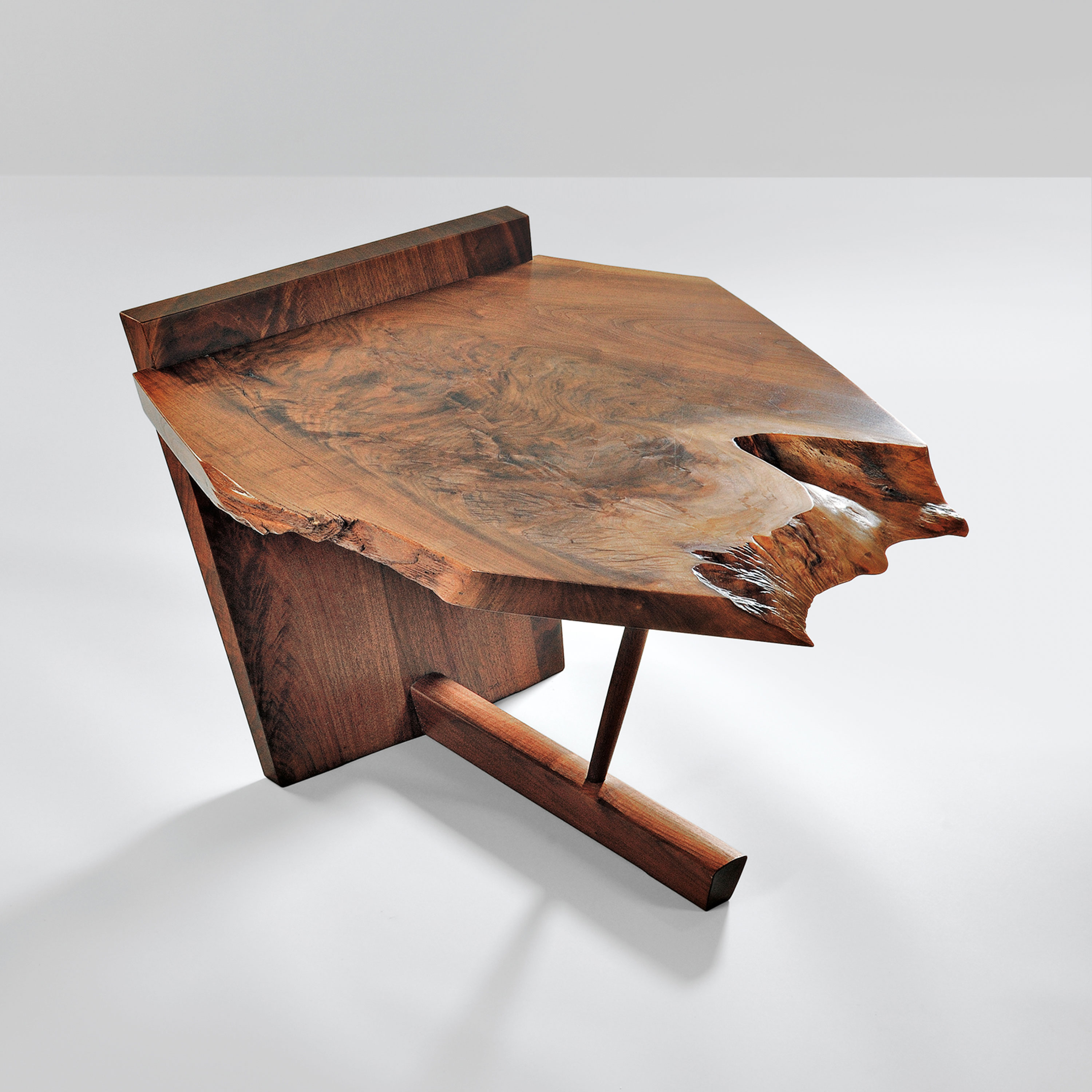 A a low table, 1976, cut from a slab of American black walnut