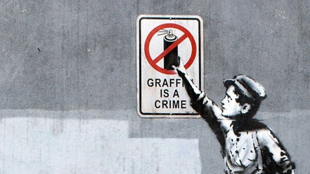Banksy, "Graffiti is a crime", immagine via domain.com