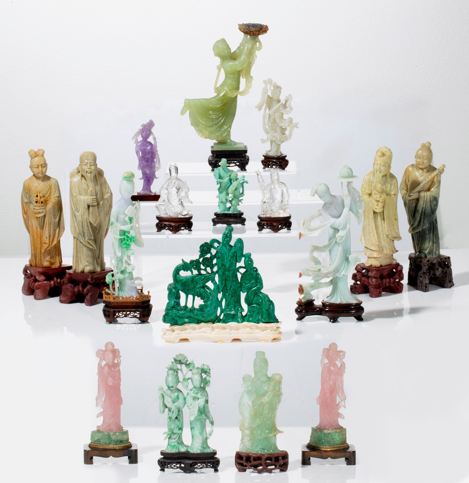 Collection of Chinese hardstone figural carvings (est. $1,000-$2,000).